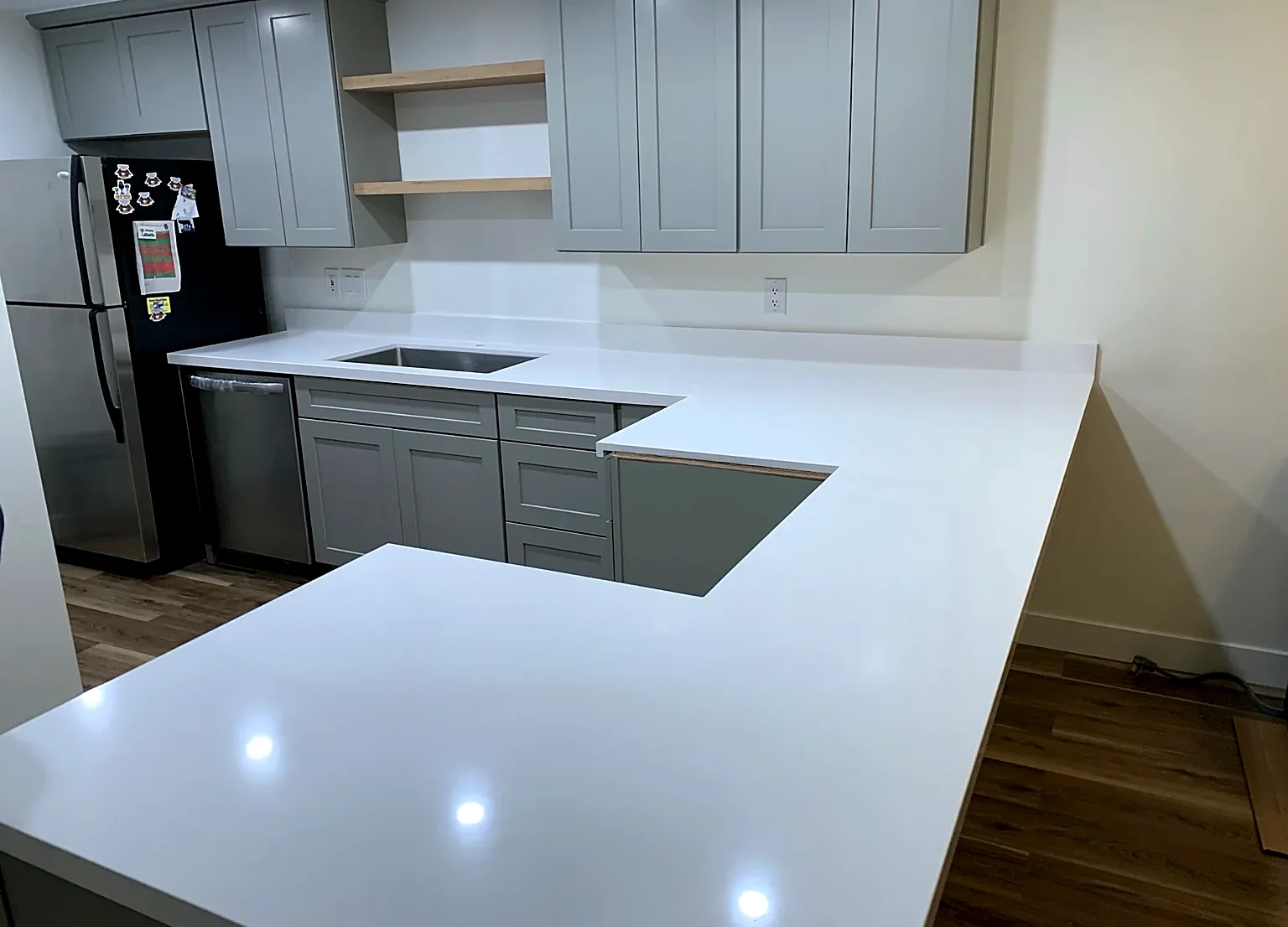 Gray cabinet kitchen with white counters